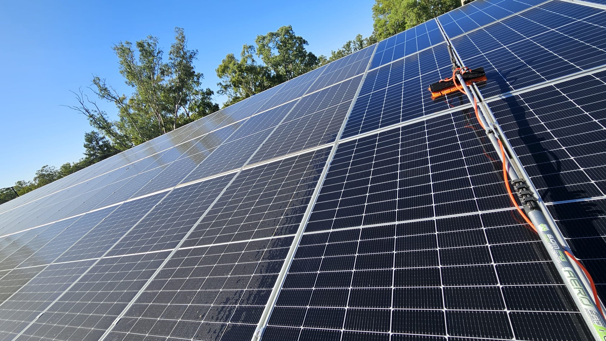 Pure water pole brush scrubbing solar panels
